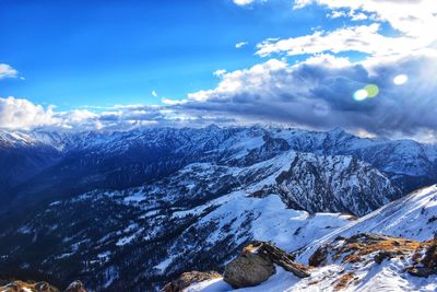 Scenic view of snowcapped mountains against sky