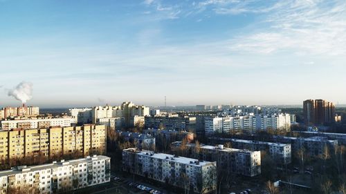 High angle view of buildings in city against sky