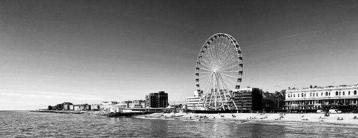 Ferris wheel against sky in city