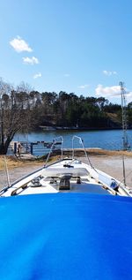 Scenic view of lake against blue sky