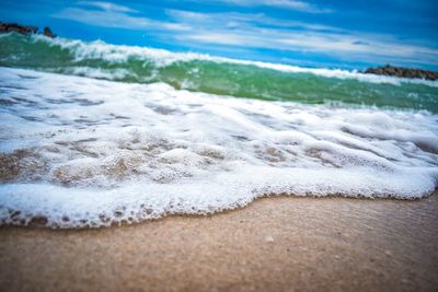 Close-up of waves rushing towards shore