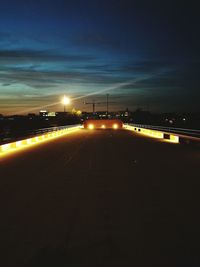 View of illuminated street light against sky