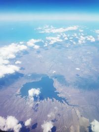 Aerial view of landscape and sea against sky