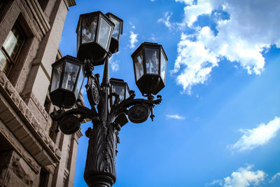 Low angle view of street light against sky