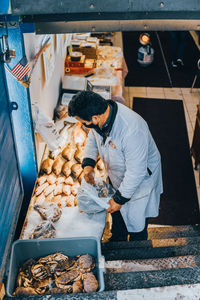 High angle view of man working at market