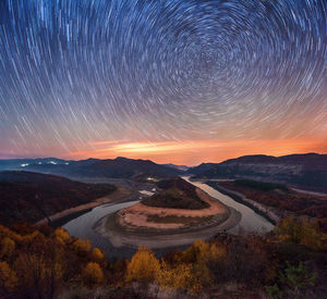 Scenic view of landscape against sky at night