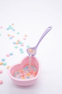 Close-up of drink against white background