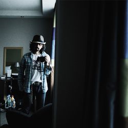 Young man having coffee at home