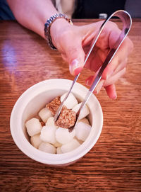 High angle view of person having breakfast on table