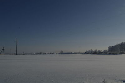 Scenic view of frozen landscape against sky