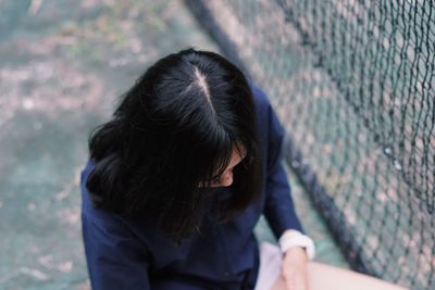 High angle view of woman by net