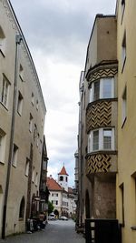 Street amidst buildings in city against sky