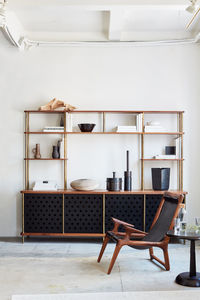 Modern, wood and metal livingroom console with chair and table