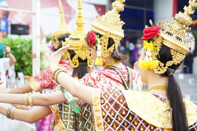 Women in traditional clothing dancing outdoors