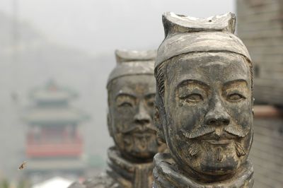 Close-up of statues at great wall of china