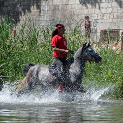 People in water splashing