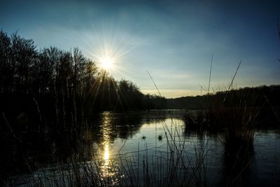 Scenic view of lake against sky during sunset