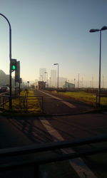 Road against clear sky at sunset