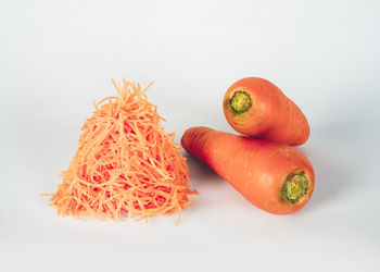 Close-up of chopped fruits against white background