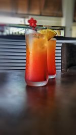 Close-up of orange juice in glass on table