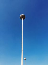 Low angle view of street light against clear blue sky