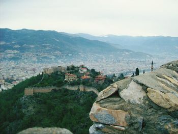 Cityscape with mountain range in background