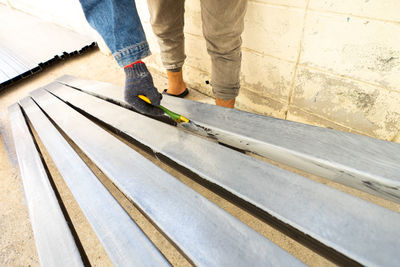 Low section of person standing on staircase