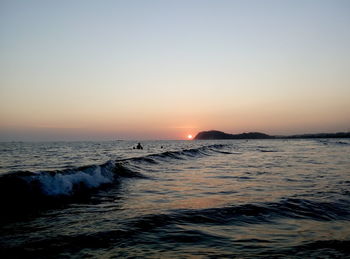 Scenic view of sea at sunset