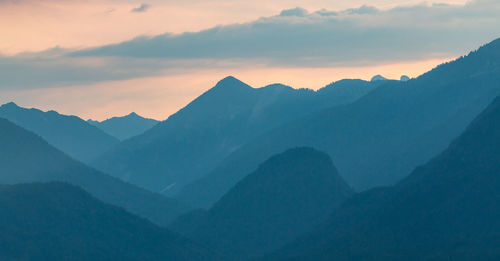 Scenic view of mountains against sky during sunset