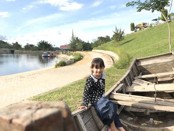 Smile of a small child at the edge of the reservoir