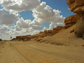 View of desert road against sky