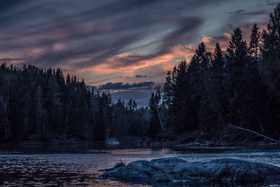 Scenic view of frozen lake against sky during sunset