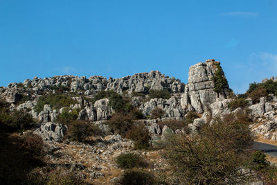 Scenic view of mountains against clear blue sky