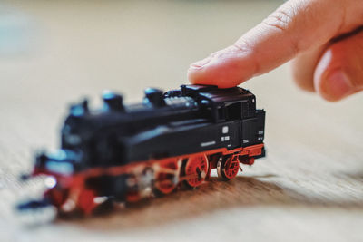 Close-up of hand holding toy car