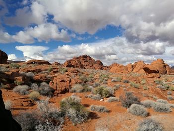 Scenic view of mountains against cloudy sky