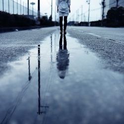 Reflection of woman in water