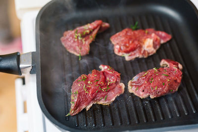 Close-up of meat on barbecue grill