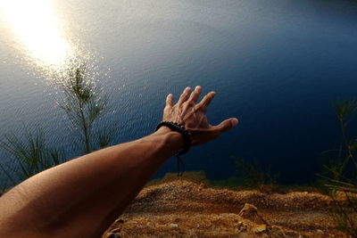 Low section of person legs in lake