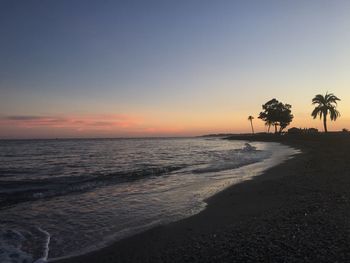 Scenic view of sea against sky at sunset