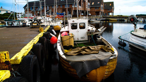 Fishing boats moored at harbor