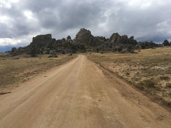 Road amidst landscape against sky