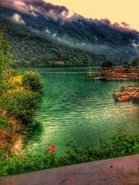 Scenic view of lake against cloudy sky