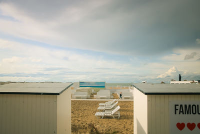 Beach huts against sky