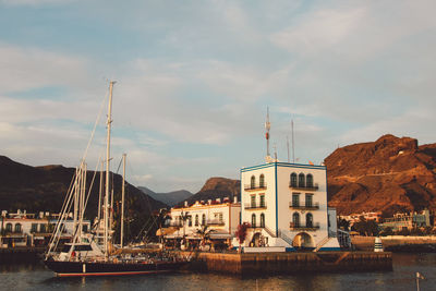 Boats moored at harbor