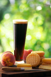 Fruits and beer glass on table