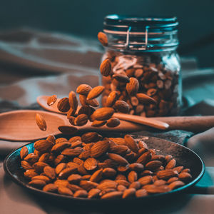 Brown almonds over plate