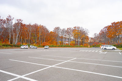 Cars on road against sky