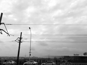 Low angle view of street lights against sky