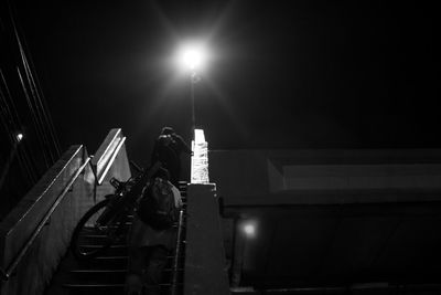 Low angle view of illuminated built structure at night