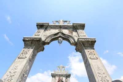 Low angle view of built structure against blue sky